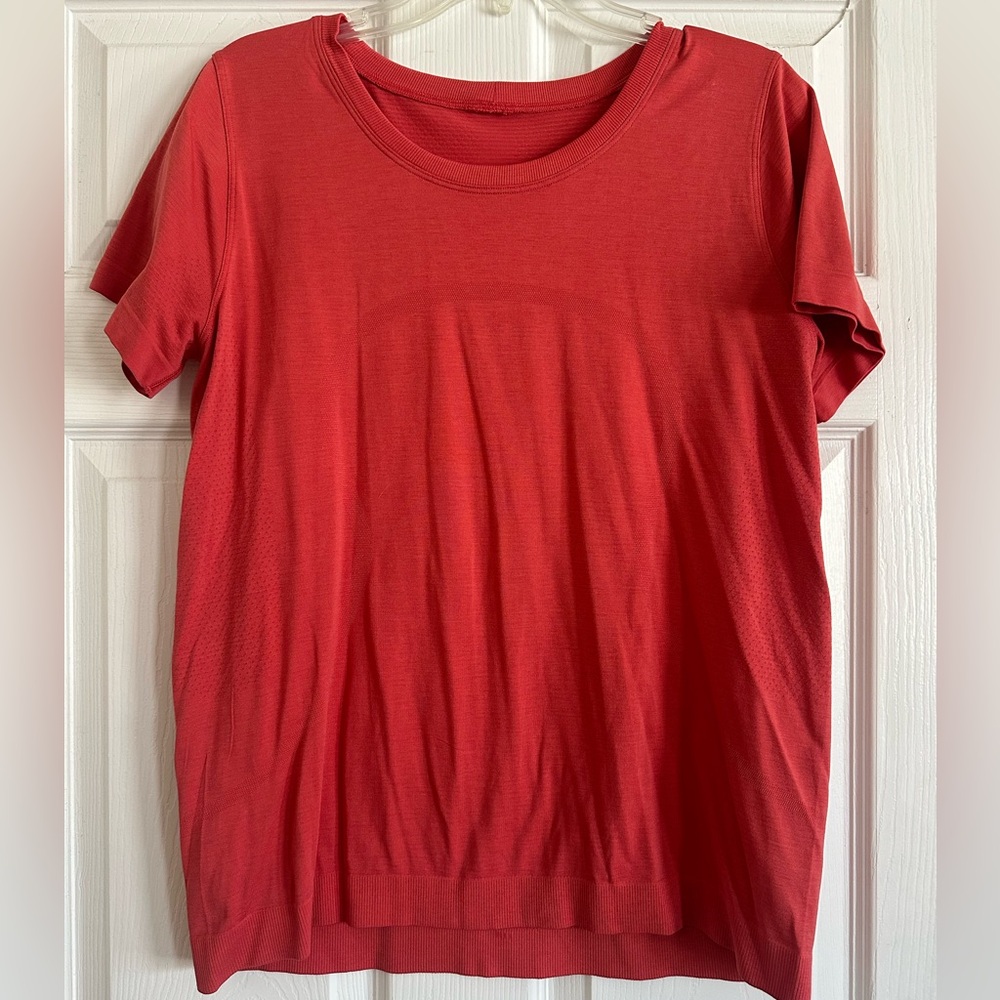 Women’s Swiftly Tech Short Sleeved Shirt. Great condition. Coral, size 10.
